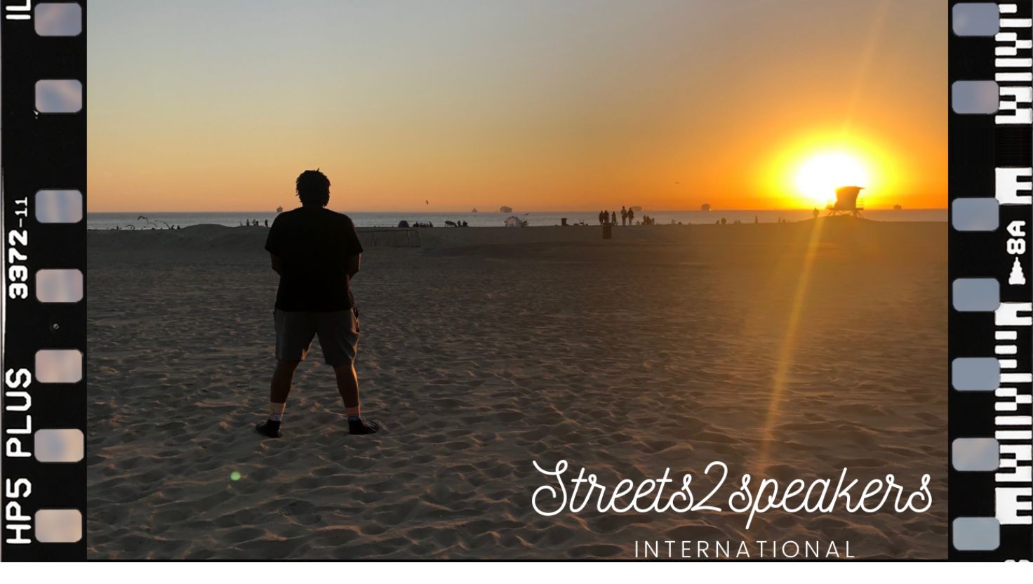 Streets 2 Speakers International beach sunset framed as a 35mm film strip